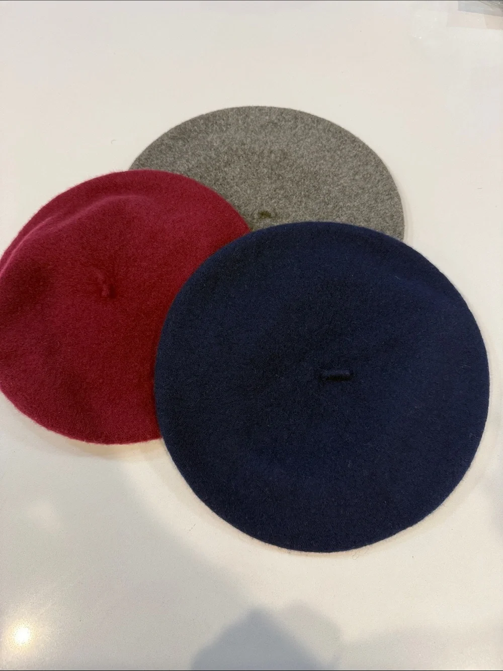 Three Wool Berets in Navy, Burgundy, and Gray